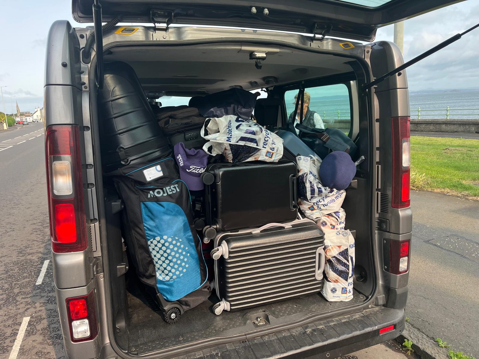 Renault Trafic loaded with suitcases and golf clubs beside the Fife coast